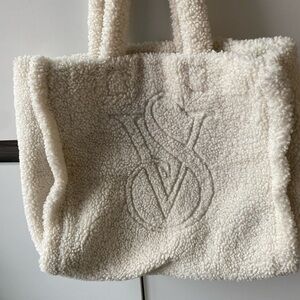 White  Victoria’s Secret tote bag
- Main pocket and small pocket inside.